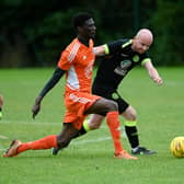 Damolly striker Ibrahim Savage shrugs of Cleary Celtic's Shay McAllister on Saturday. RS2341409