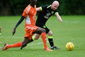 Damolly striker Ibrahim Savage shrugs of Cleary Celtic's Shay McAllister on Saturday. RS2341409