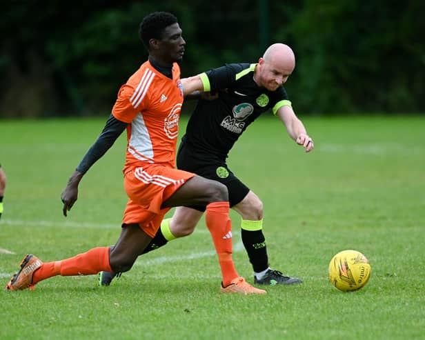 Damolly striker Ibrahim Savage shrugs of Cleary Celtic's Shay McAllister on Saturday. RS2341409
