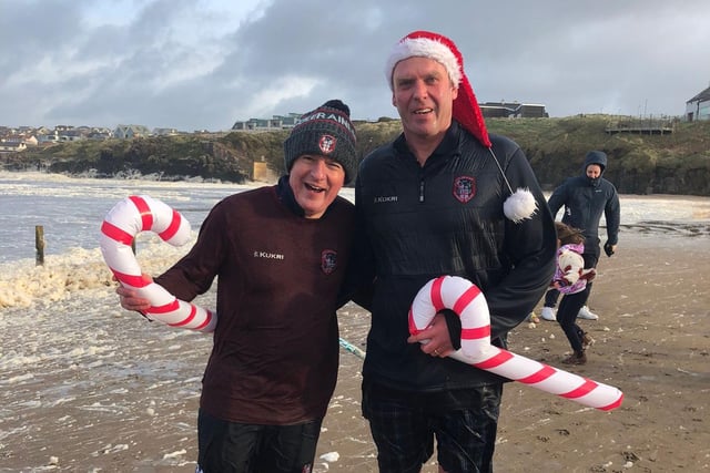 Making their sea dip debut on Portstewart Strand are teachers Mr Semple and Mr Cartmill