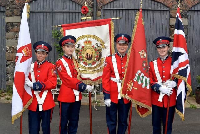 Upper Bann Fusiliers Flute Band and Bleary Crimson Star LOL 12 will lead the main Co Armagh Twelfth parade this year.  Pictured at the recent Somme parade in Lurgan are the band's standard bearers, from left, Oivia Twinem, Emily Blair, Heather Healey and Amelia Wells. LM 27-217. Picture credit: Tony Hendron