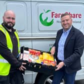 Connor Martin from Fareshare collects food product donations from Musgrave NI’s Director of Marketing, Desi Derby. Pic credit: Musgrave NI