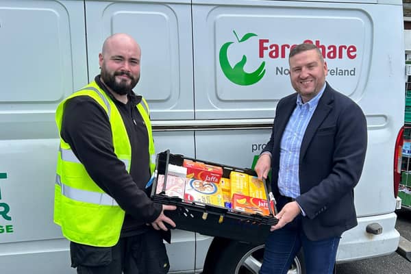 Connor Martin from Fareshare collects food product donations from Musgrave NI’s Director of Marketing, Desi Derby. Pic credit: Musgrave NI