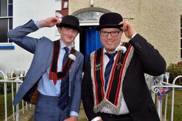James Cassells and his dad Nigel from Tandragee, pose for the camera at the RBP Last Saturday parade in Loughgall. PT35-201. 