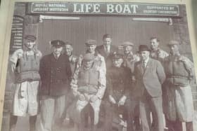 Donaghadee RNLI: Coxswain Andrew White with the crew outside the lifeboat station when it was still known as the boathouse as it did actually house the boarding boat for the lifeboat
