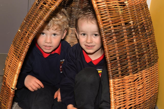 Having fun in their hiding place at Orchard County Primary School Nursery Unit  are pupils Noah and James. PT41-325.