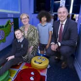 Education Minister Paul Givan pictured with Specialist Provision Teacher Michelle Chesire and pupils, during the official opening of a new Specialist Provision class and sensory room at Lislagan Primary School. CREDIT DE