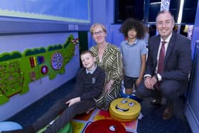 Education Minister Paul Givan pictured with Specialist Provision Teacher Michelle Chesire and pupils, during the official opening of a new Specialist Provision class and sensory room at Lislagan Primary School. CREDIT DE