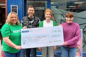Stefani Mearns (left), NSPCC NI fundraising supporter manager, receives a cheque for £2,270.56 from Ryan Moffett and Sophie Grier from Uplift Performing Arts and writer and composer, Keira Aiken.  Photo submitted by NSPCC NI.