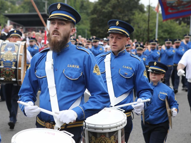 Members of Constable Anderson Memorial Flute Band step out in Larne for the 'Last Saturday' parade.