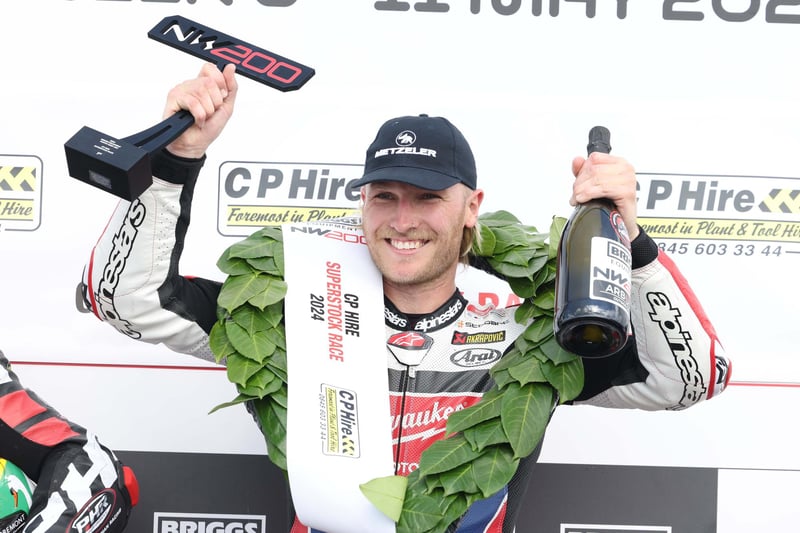 Davey Todd celebrates his second race win of the afternoon after securing Superstock success