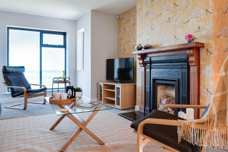 Lounge area with feature fireplace.