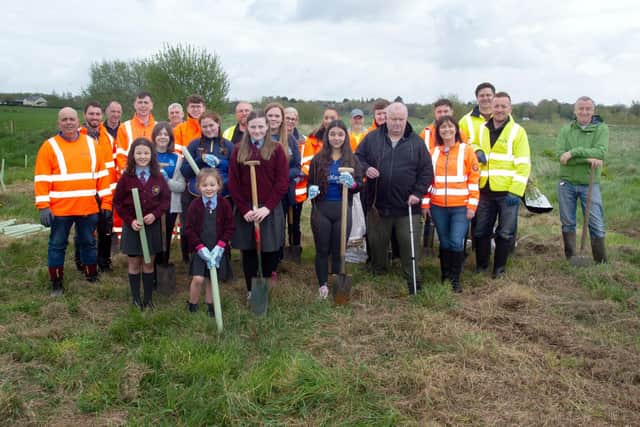 Pictured at the start of the tree planting between Churchill Park and the River Bann are pupils from Ballyoran Primary School, representatives of Drumcree Community Trust, Woodside Residents Association, Amey Consulting and other volunteers. PT17-200 Picture: Tony Hendron
