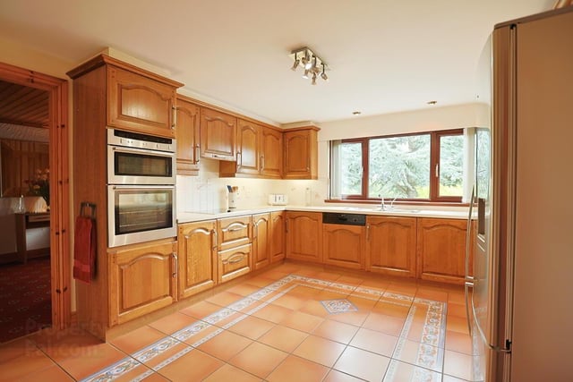 The attractive kitchen features a high and low level units, with built in oven, hob and dishwasher. It has partially tiled walls and a fully tiled floor.