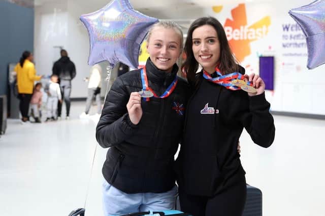 Emma Lutton (left) and Ellie Goggin with their ice skating medals. Picture courtesy of Belfast City Airport.
