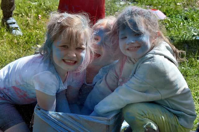 Junior pupils of Ballyoran Primary School enjoy the day out at the school charity colour run. PT21-207.