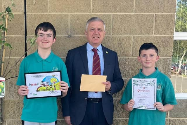 Tynan McWilliams, runner up and Jamie Crampsie, highly commended in the special school’s section of the 2023 schools’ competition pictured with UFU deputy president
and Bank of Ireland Open Farm Weekend chairman William Irvine. Credit: Ulster Farmers' Union