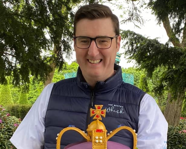 Ian with the crown cake he designed for the royal visit to Newtownabbey.