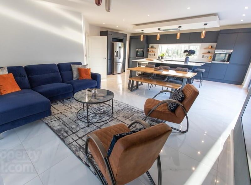 The beautiful open plan kitchen / dining / living space is filled with natural light.