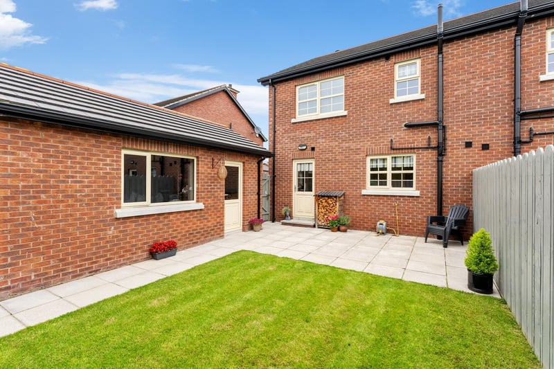 The fully enclosed south facing private rear garden is laid in lawn to the rear, with a paved patio area. The garage has an up and over roller door, power and light and a pedestrian side door.