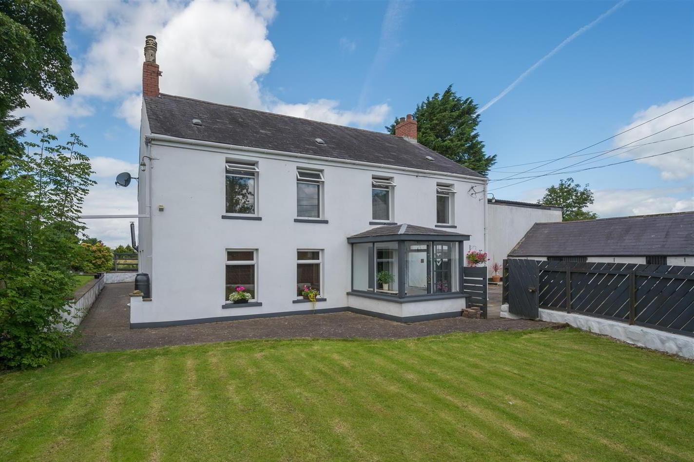 The farmhouse style detached home, enjoying delightful rural views to rear, is situated off the Hydepark Road, Mallusk, Newtownabbey.
