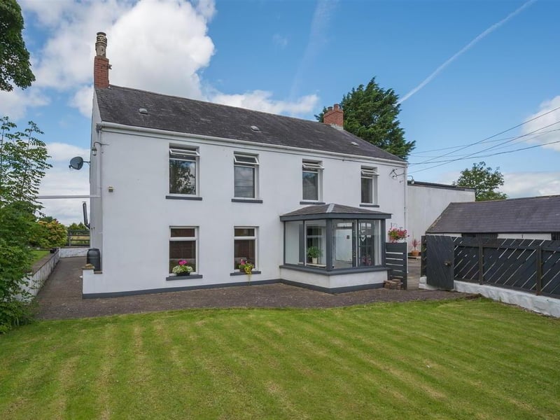 The farmhouse style detached home, enjoying delightful rural views to rear, is situated off the Hydepark Road, Mallusk, Newtownabbey.