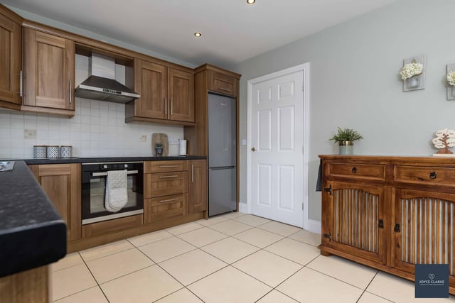 The kitchen / dining area has a range of high and low level kitchen cabinets. Appliances include an eectric oven, four ring induction hob with stainless steel extractor canopy above. There is space for a fridge freezer and dishwasher.