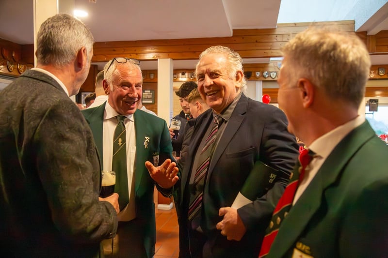 Gerry Armstrong chatting with guests at Larne RFC's annual dinner.