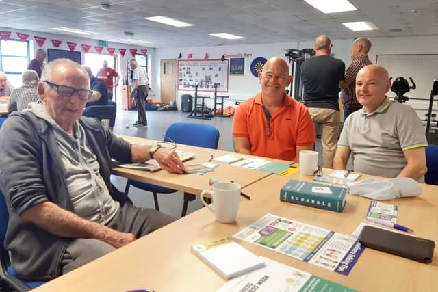 Michael Collins, David Cooney and Gordon Owens enjoy a very competitive game of Scrabble at the HIM (Health in Mind) Men's Group at The Fitzone Foundation in Craigavon, Co Armagh.