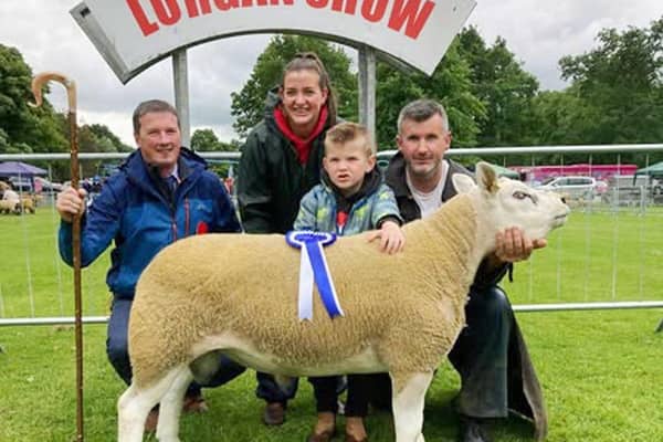 Naomi, Rian & Pearse O'Hare with their Reserve Texel Champion, Ballykeel Holy Bejoly.  Also pictured is Judge Philip Whyte