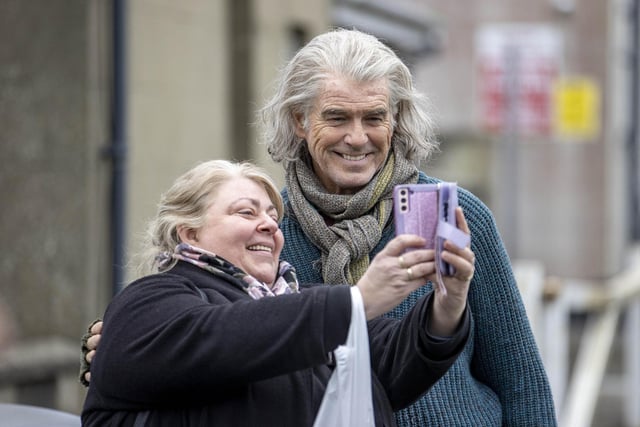 Pierce Brosnan smiles for a selfie during the filming of “Four Letters of Love” in Ballycastle on Tuesday afternoon