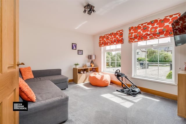 Family room with twin windows to front elevation.
