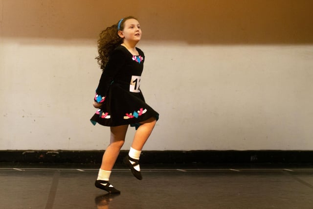 Hollie Seeds dances around the stage as she takes part in the under 8 years Light Double Jig competition at Portadown Folk Dancing Festival. PT10-222.