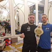 Karl Agnew (blue) with trainer Iain Mahood after his victory at the Tullyglass Hotel. (Pic: Contributed).