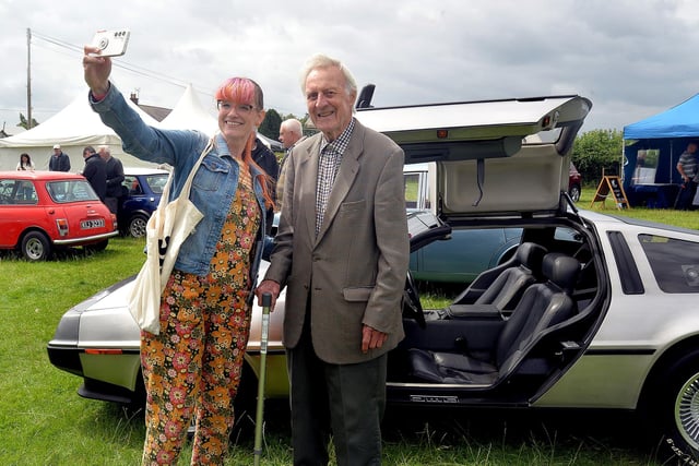 Taking a selfie with the DeLorean car at the  Birches Vintage Rally are Julie Jamison and her father Stanley Trouton. PT27-210. Photo by Tony Hendron