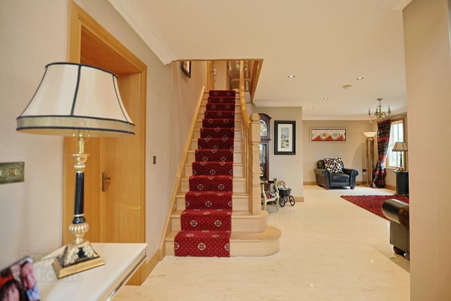 The beautiful entrance hall / living space has a composite front door and a fully tiled floor.