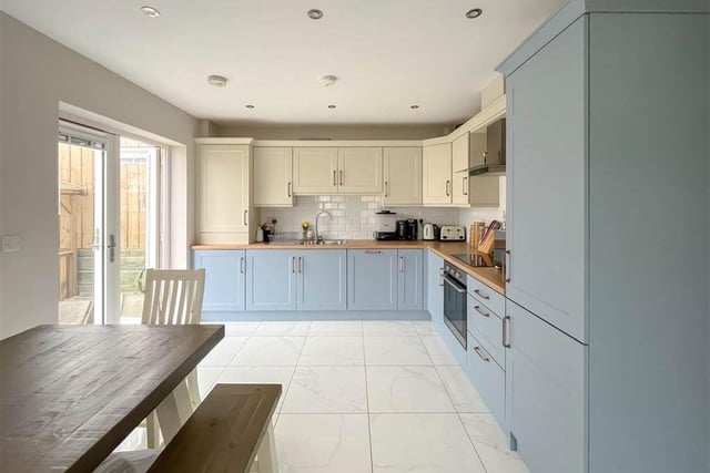Fitted kitchen with range of high and low level units.