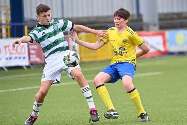 Celtic's Jacob Cameron  in action with Dungannon's Tadhg Feeney.