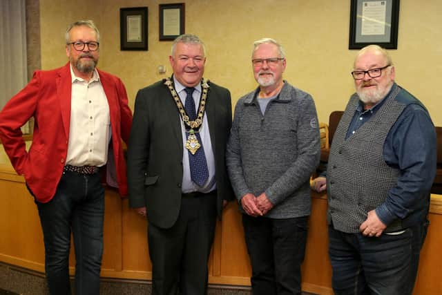 The Mayor of Causeway Coast and Glens Borough Council, Councillor Ivor Wallace, with Martin Magee, Roger Perritt and Peter Molloy, members of Friends of Ballycastle Museum.