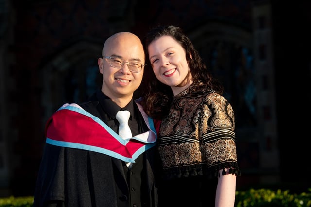 Yifan Wang graduating with an MSc from Queen's Management School with partner Niamh Doherty.