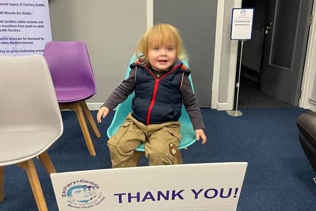 Zander Zachary Geddis, Yasmin’s son, with a thank you message to Causeway Coast and Glens Borough Council for funding the Alternative Xmas Campaign. Credit Zachary Geddis Break the Silence Trust