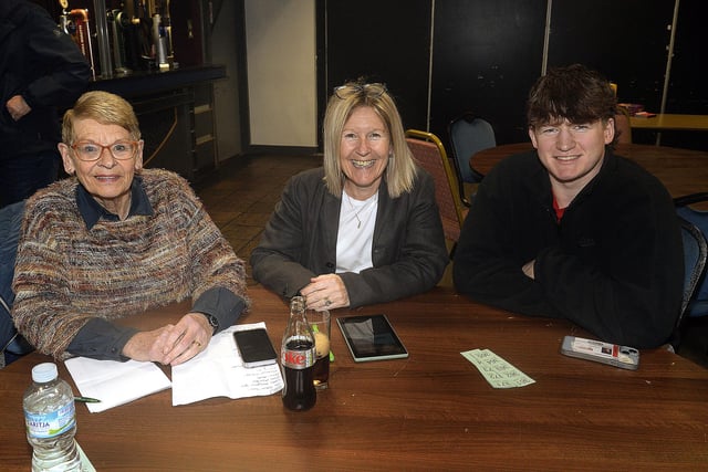 Ready for the questions at the annual Friends Of Portadown College quiz are from left, Helen McCann, Andrea Herron and Joshua Herron. PT09-208.