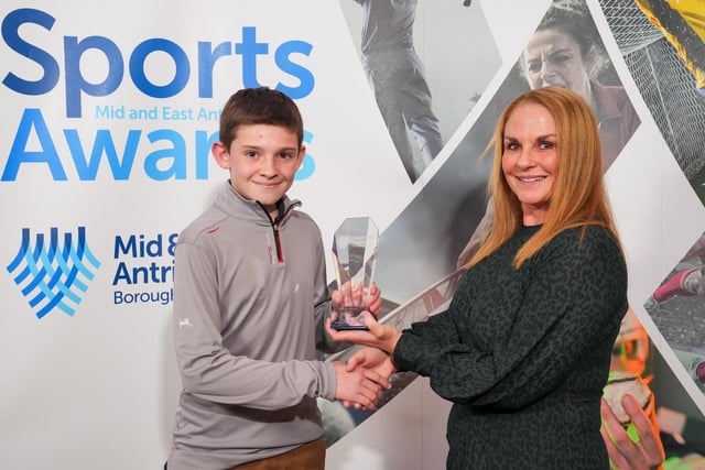 Geraldine Hastings from Hastings Financial Services presents Calum Pollard with the Junior Sportsperson award.