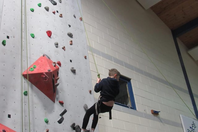 Trying the climbing wall at North Coast Integrated College Open Night
