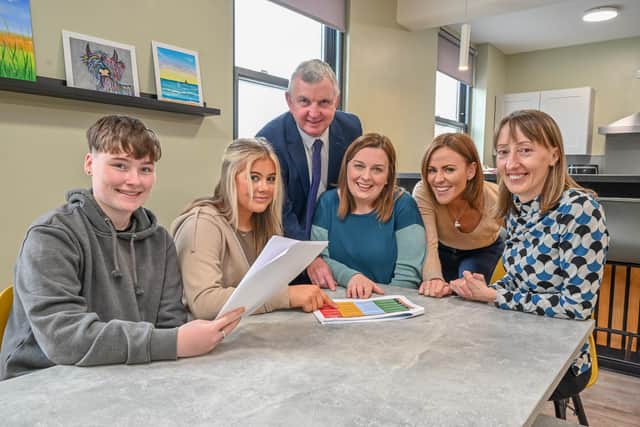 The Housing Executive awarded a £50k grant to Lisburn YMCA to help young people sustain their tenancies. Looking over projects in the current scheme are (left to right) Amie McCormack and Kelsey McKibben, service users, Des Marley, Housing Executive, and Anna Kissick, Nikki McTaggart and Pauline McMullan, all YMCA. The closing date for the next tranche of grants is Friday, October 20. Picture: Simon Graham