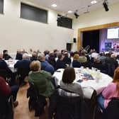 Full hall of audience members