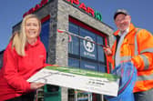 Stephen Marshall, from Eco Rangers NI, with Bronagh Luke, from Spar NI, to receive a cheque for £2,000 as part of the retailer's Community Cashback Grant Scheme.