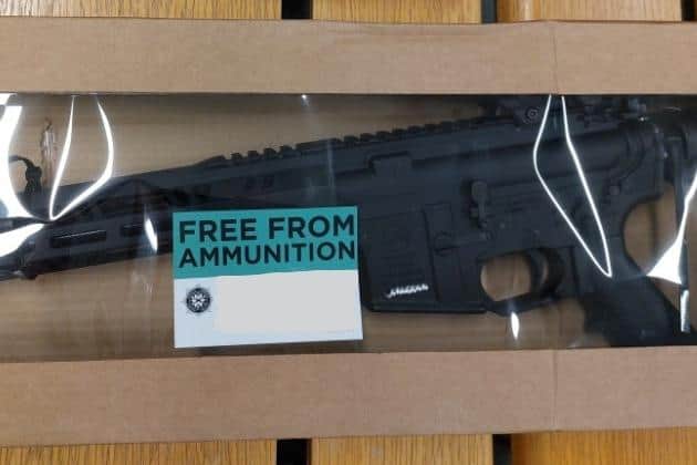 Police photo of a suspected military-style assault weapon seized.