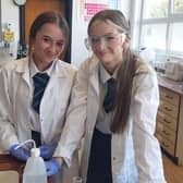 Lexi McCook and Hallie Davis from Ballymoney High School who were measuring the calorie content of snack foods at the Science workshop at Northern Regional College. Credit NRC