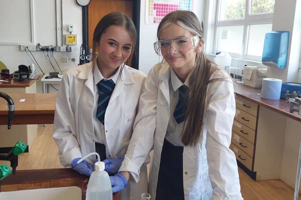 Lexi McCook and Hallie Davis from Ballymoney High School who were measuring the calorie content of snack foods at the Science workshop at Northern Regional College. Credit NRC